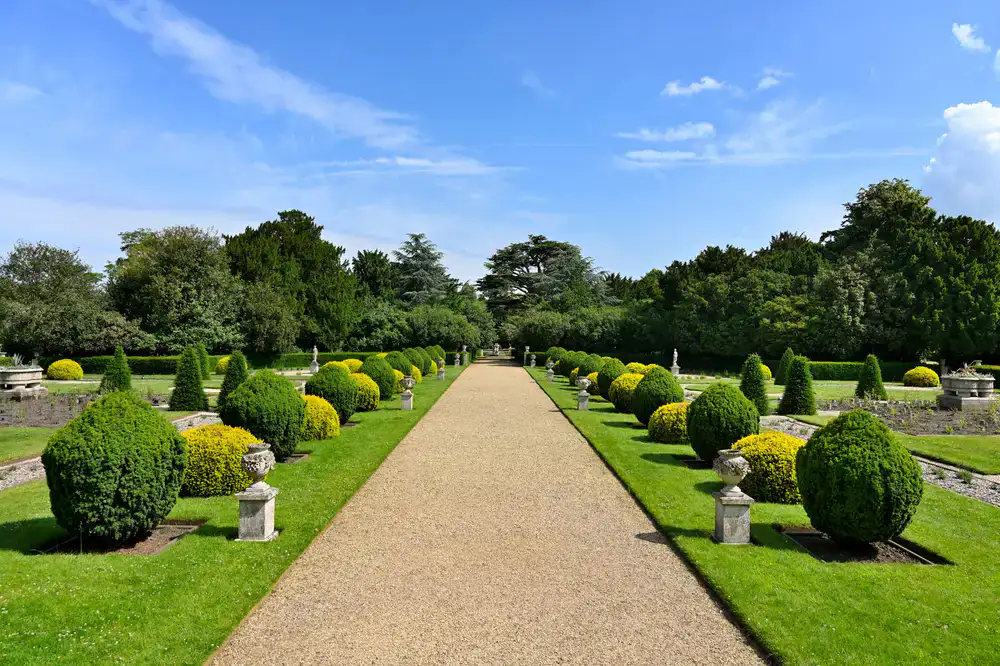 Expertly maintained residential garden with manicured lawn and neat borders